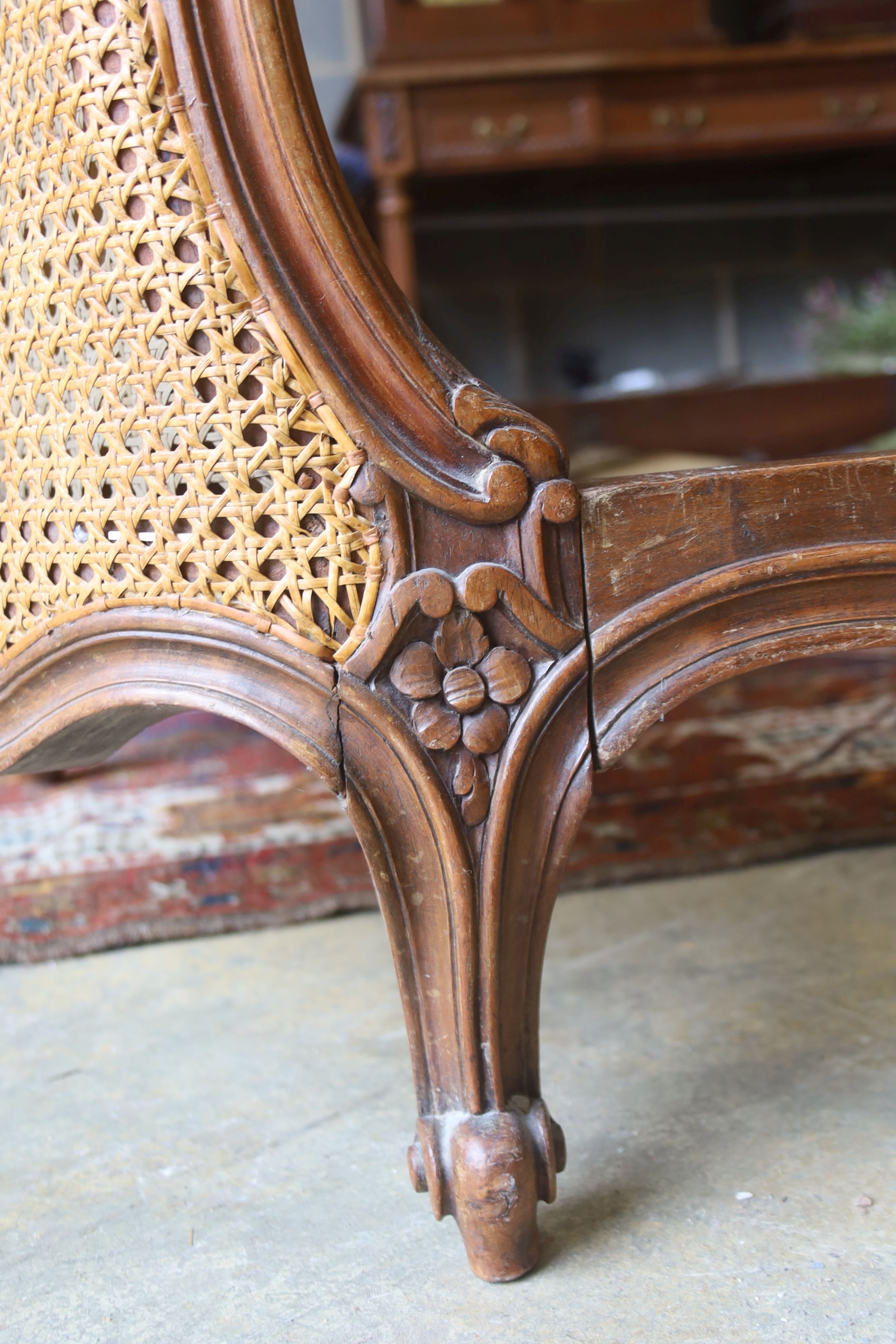 A late 19th / early 20th century French caned walnut double bedframe, width 150cm, length 210cm